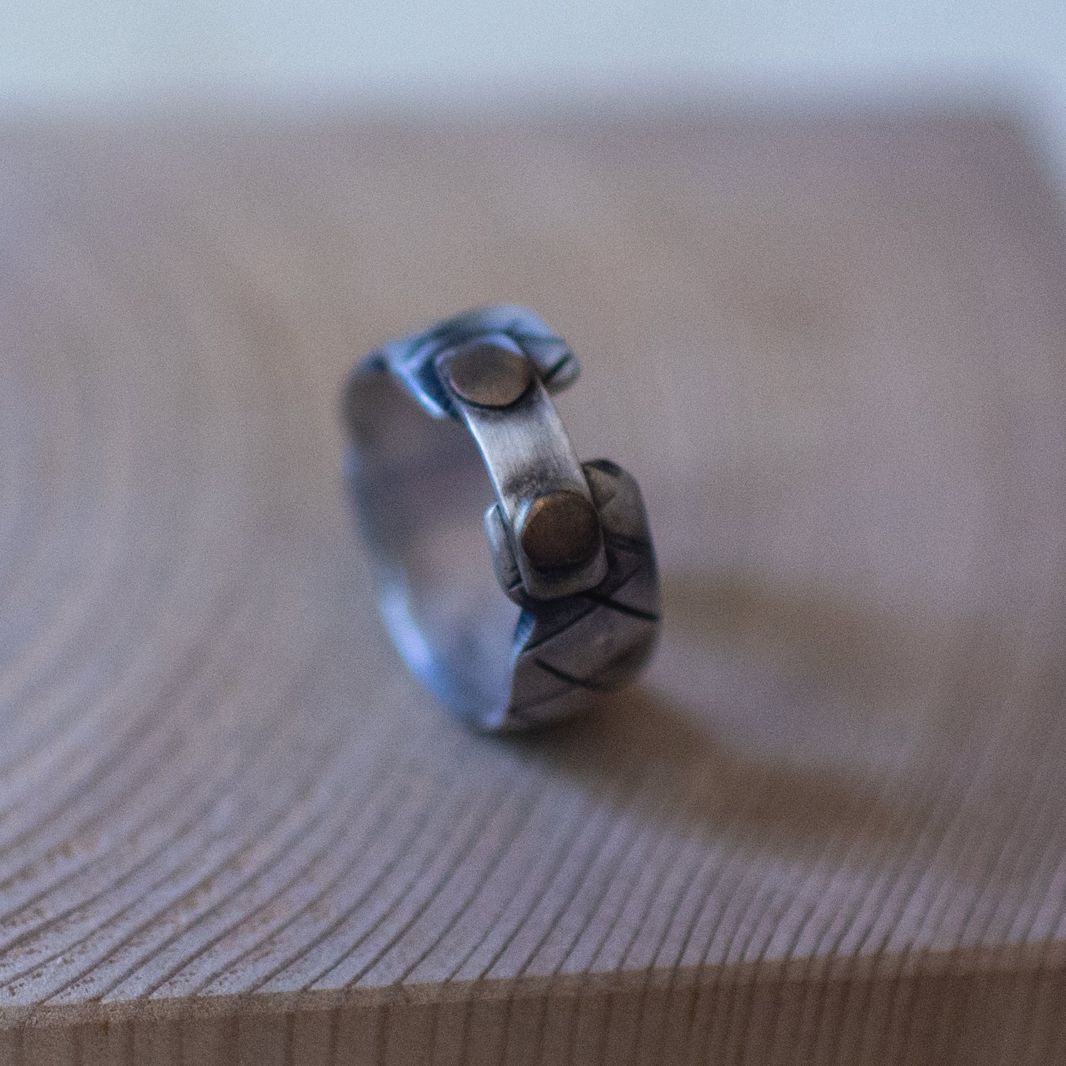 Briefcase ring – handcrafted sterling silver band size 10.5 with rivet-style details and oxidized industrial design, unisex artisan jewelry.