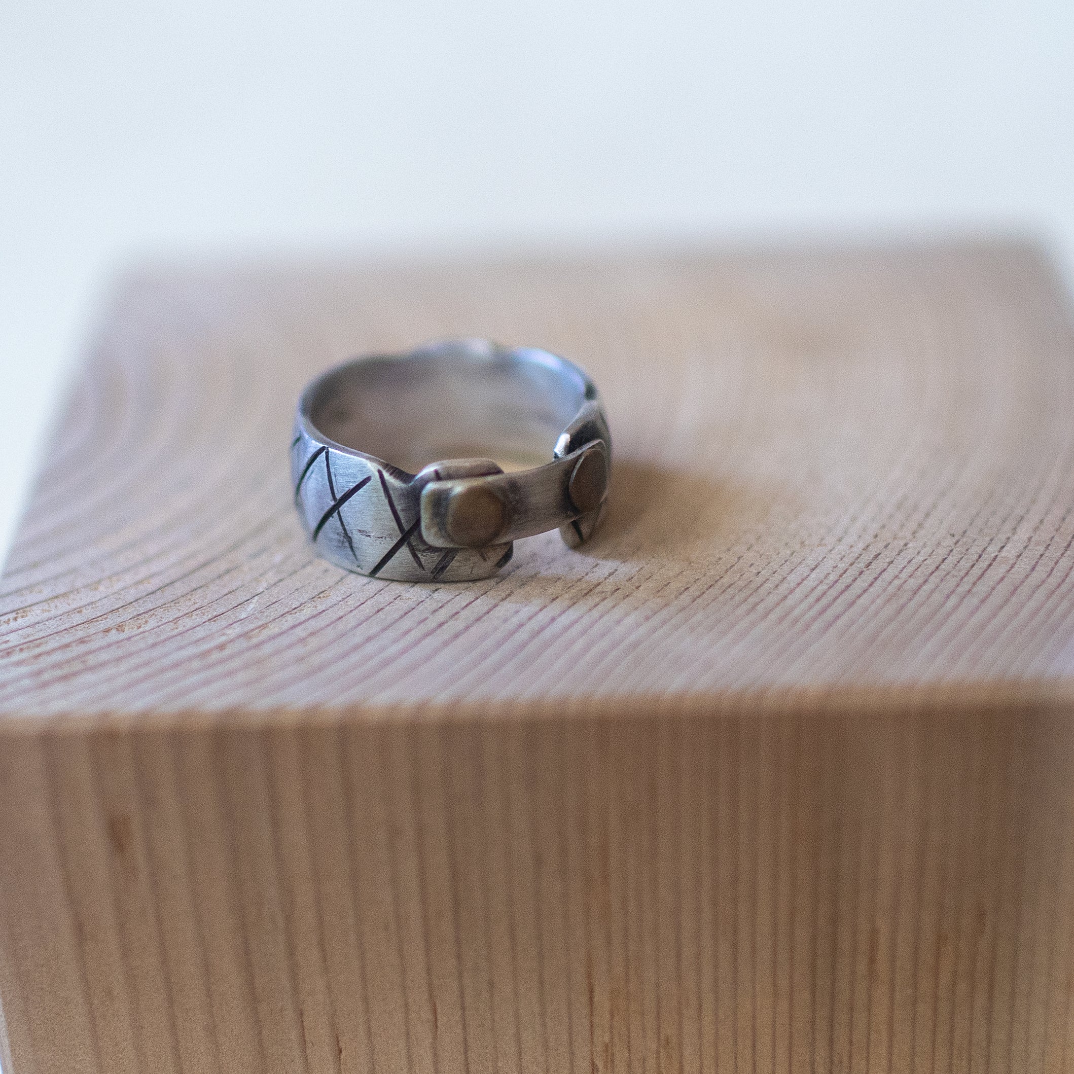 Briefcase ring – handcrafted sterling silver band size 10.5 with rivet-style details and oxidized industrial design, unisex artisan jewelry.