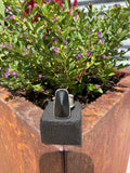 Master size 11 ring with coned black onyx stone wrapped in sterling silver on layered stamped band