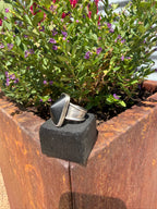 Master size 11 ring with coned black onyx stone wrapped in sterling silver on layered stamped band