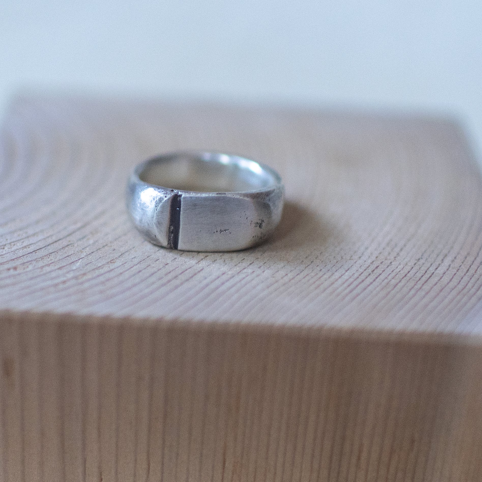 Meridian – artisan sterling silver ring size 11 with a wide polished band and a single vertical engraved line, handcrafted unisex minimalist jewelry.