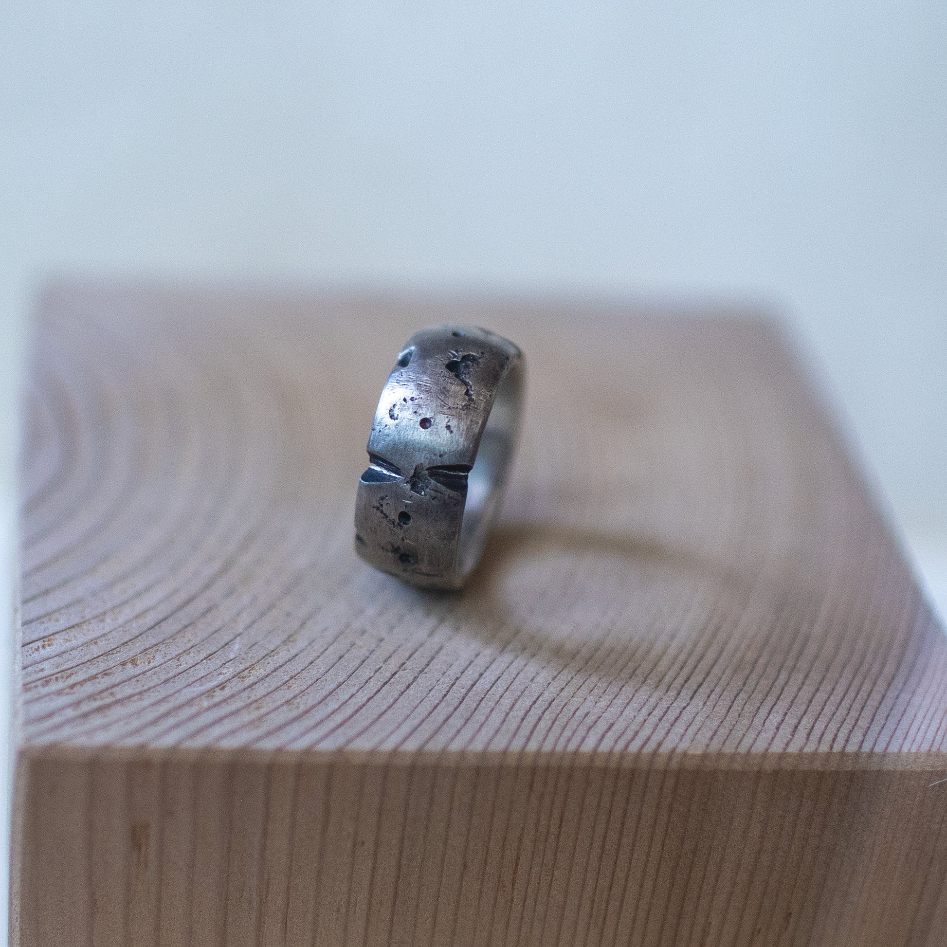 aldera ring – handcrafted sterling silver band size 9.5 with cratered volcanic-inspired texture and oxidized finish, unisex artisan jewelry.