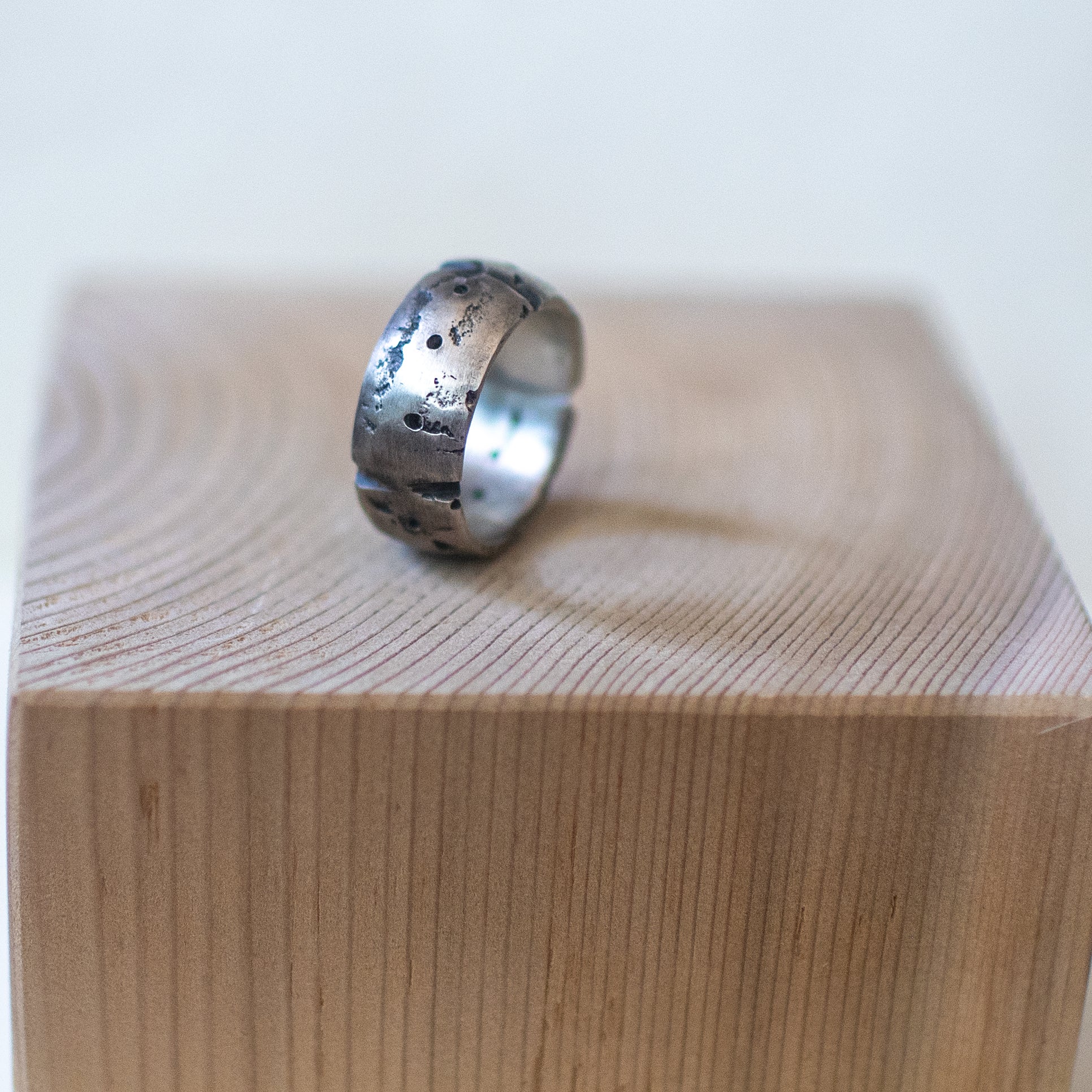 aldera ring – handcrafted sterling silver band size 9.5 with cratered volcanic-inspired texture and oxidized finish, unisex artisan jewelry.