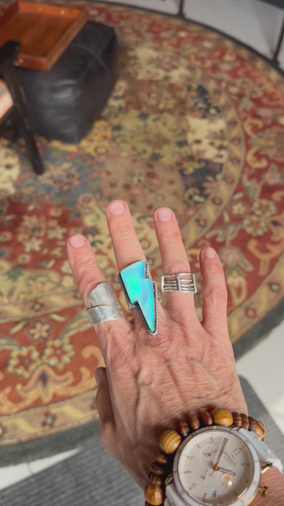 Wave ring size 7 featuring a glowing Aurora Opal stone set in handcrafted silver